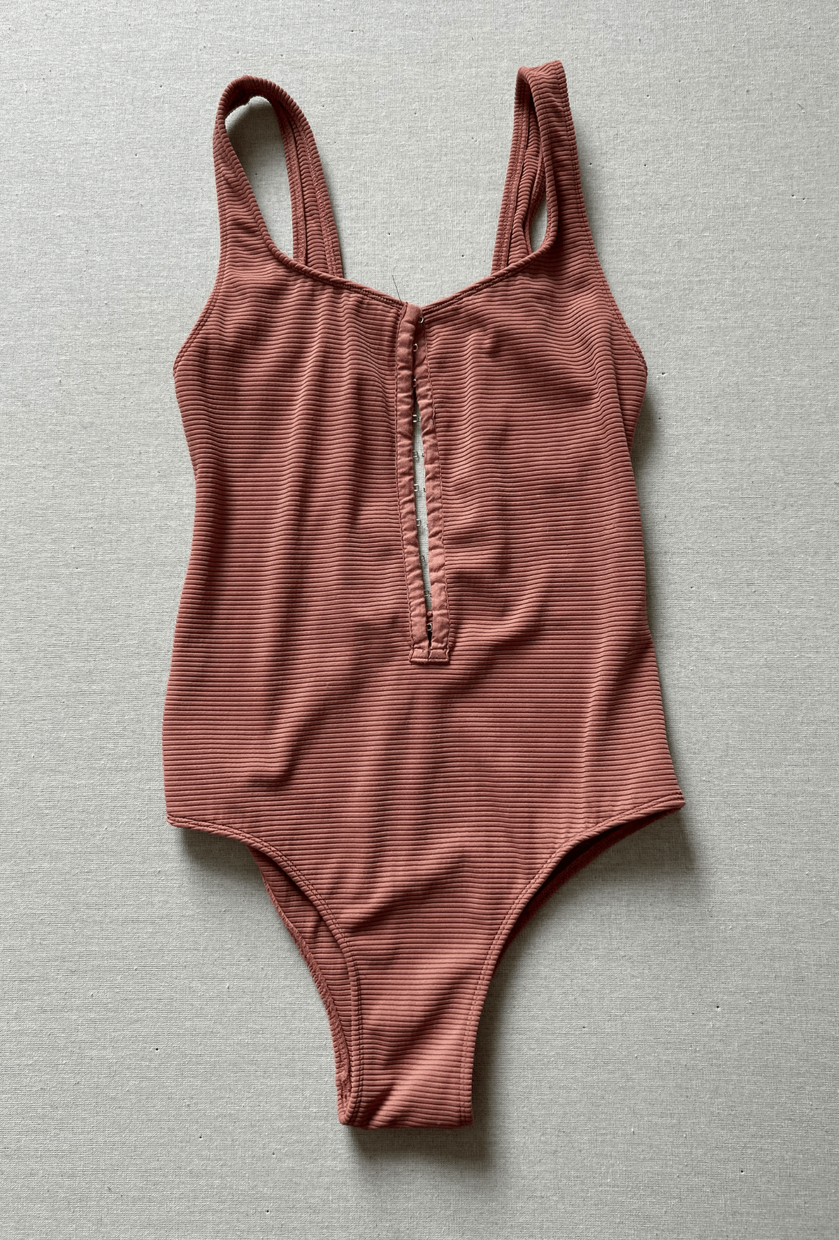 clasped one piece in blush rib - size small